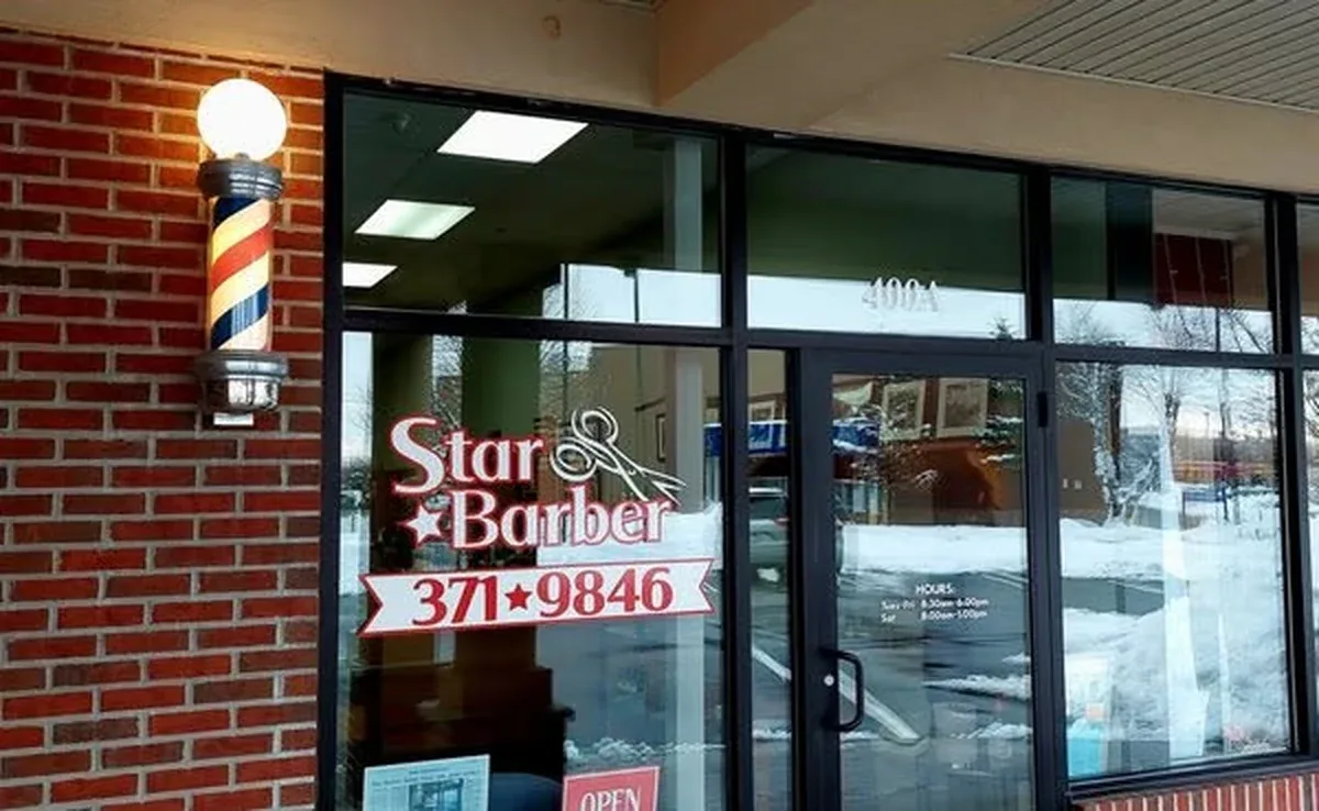 Star Barber Shop storefront with barber pole at the Shoppes of Halfmoon